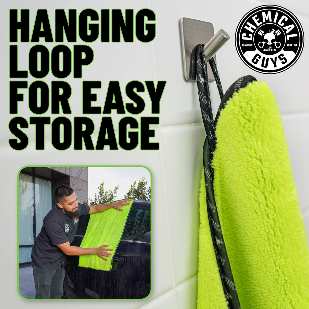 Chemical Guys neon green towel in use on a car hood for rapid drying.
