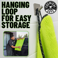Chemical Guys neon green towel in use on a car hood for rapid drying.