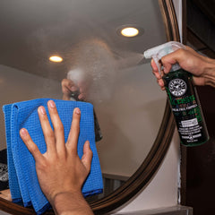 Chemical Guys Signature Series Glass Cleaner used on dirty windows before cleaning.