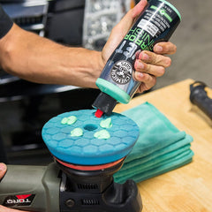 Applying Wet Mirror Finish glaze by hand on a glossy car surface.
