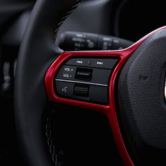 CKE dashboard trim frame in red adds a cohesive modern accent.