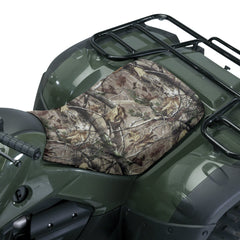 Classic Accessories QuadGear ATV seat cover in camo protecting seat from weather and wear.