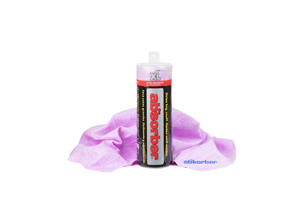CleanTools Absorber XL on a car hood, quickly absorbing water for a streak-free dry.