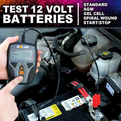 Clore Automotive SOLAR Digital 12V Battery Tester in use demonstrates portable handheld design.