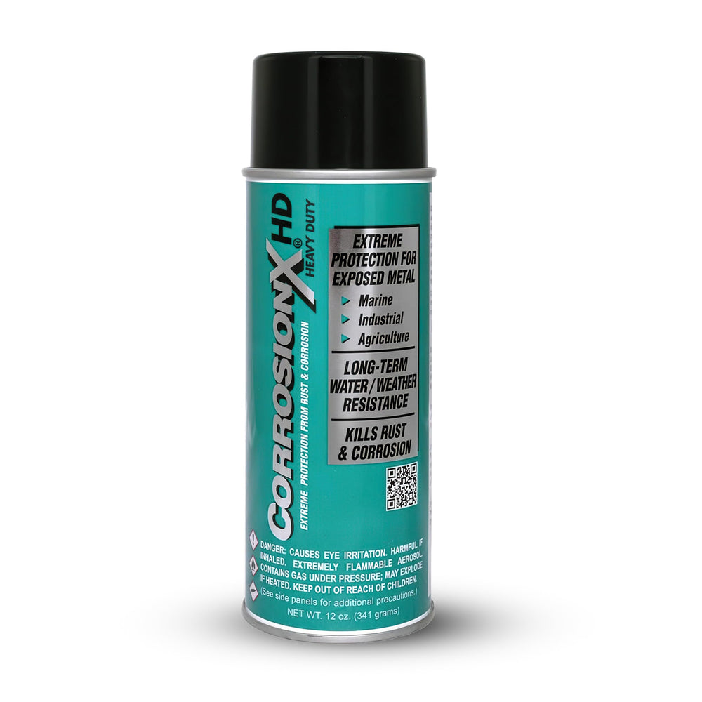 CorrosionX Heavy Duty spray bottle applying durable rust protection to metal surfaces.