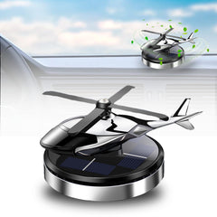 Corunkeer rotating solar helicopter diffuser on dashboard providing steady fragrance