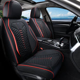 Coverado front seat covers in black and red protect upholstery while adding style