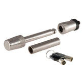 CURT 23580 stainless hitch lock installed in a receiver for secure towing.