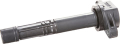 Denso 673-2301 installed in an engine bore demonstrates direct ignition approach.