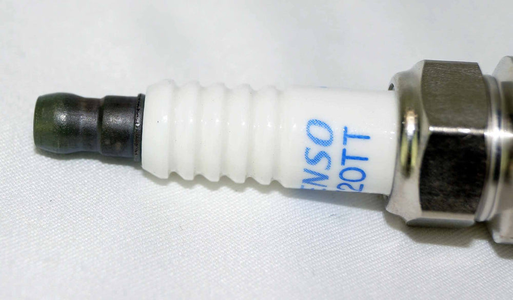 Denso Platinum TT spark plug component closeup for high-performance engines