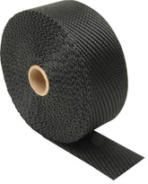 Design Engineering black titanium exhaust wrap with lava rock fibers encases 2x25 roll for heat containment.
