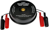 Dorman 84610 retractable test leads with magnetic backcase on a metal workbench.