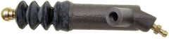 Dorman CS360025 clutch slave cylinder installed in the engine bay on compatible Acura and Honda vehicles