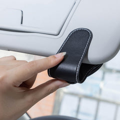DSVI car visor mount in use for easy one-handed access while driving.