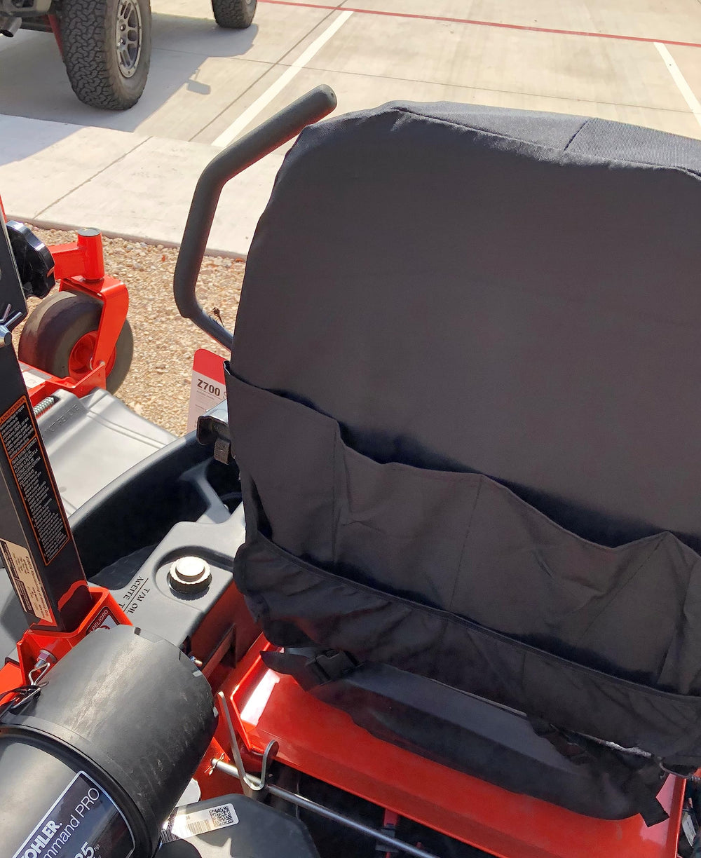 Installation straps on a Kubota/Kioti seat cover, quick secure setup.