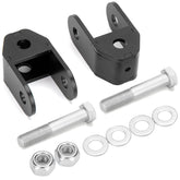 Dynofit rear shock extenders installed on a Silverado 1500 to improve suspension compatibility.