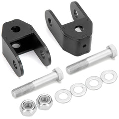 Dynofit rear shock extenders installed on a Silverado 1500 to improve suspension compatibility.