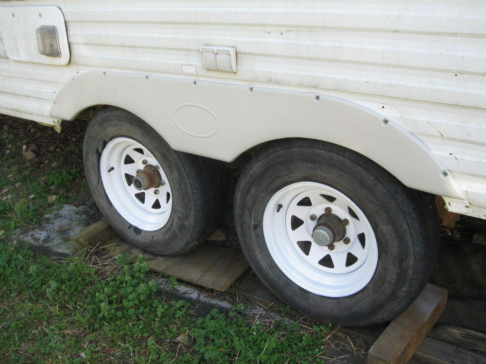 ECOTRIC fender skirt installation details: welding or hardware mounting options.