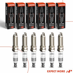 Workbench setup with spark plugs and installation guide.