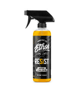 Ethos Resist graphene spray bottle applying coating to car finish for lasting gloss.