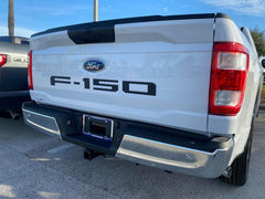 Eurosport Daytona tailgate letters on Ford F-150, bold black branding.