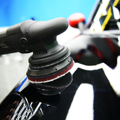 FarTryGo cutting pad in use with dual action polisher on car panel