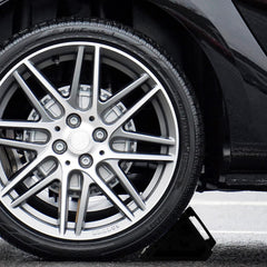 Fasmov wheel chock in travel setup demonstrates quick securing on trailers.