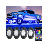 Fimker 4 pods RGB rock lights illuminate wheel wells from the front view.