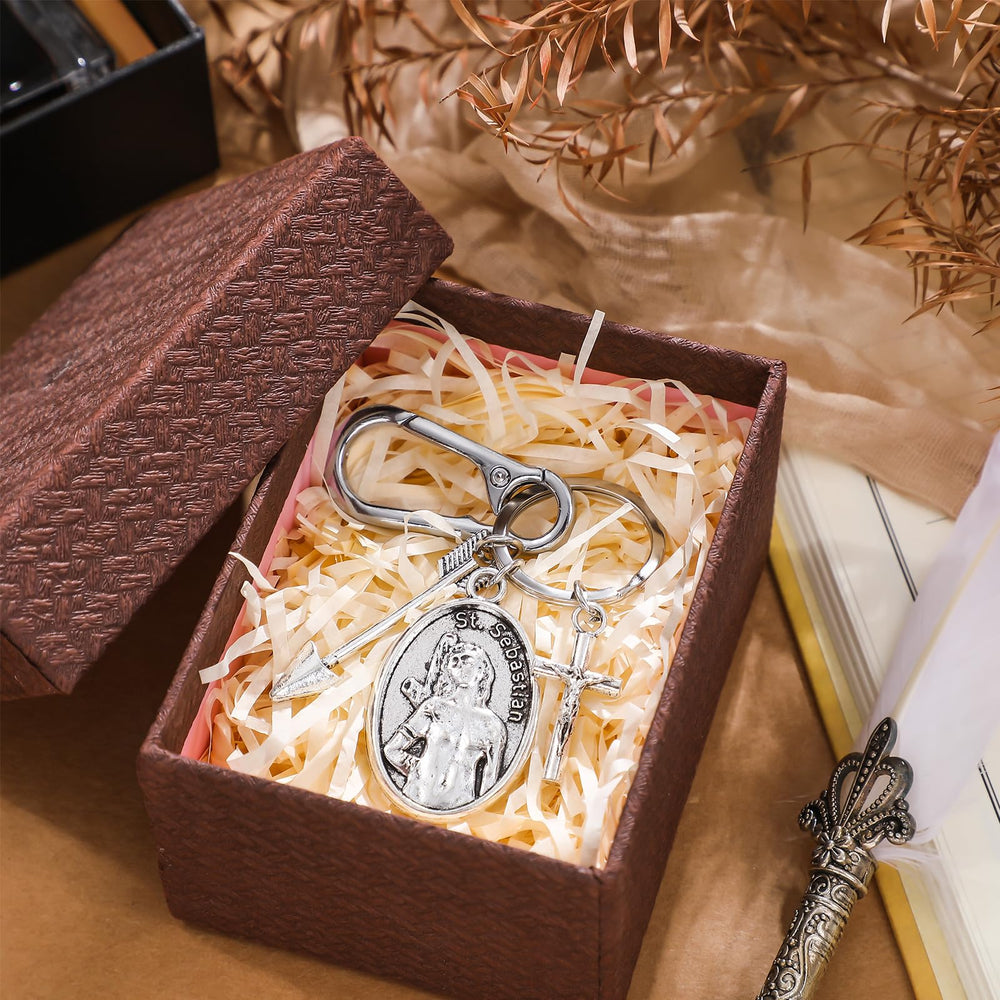 Fiwochic Saint Sebastian cross plate with durable metal finish on keychain.