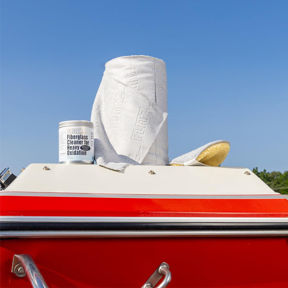 Applying FLITZ cleaner and buffing to reveal a smooth, glossy finish
