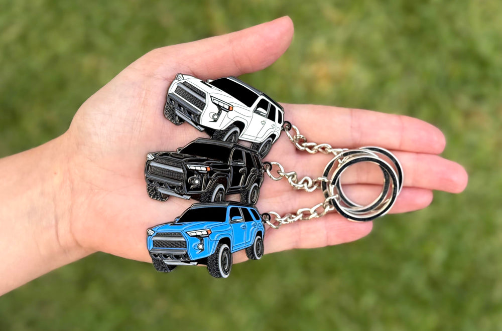 FOUR WHEEL BEAST 4Runner keychain metal body texture closeup for tactile quality.