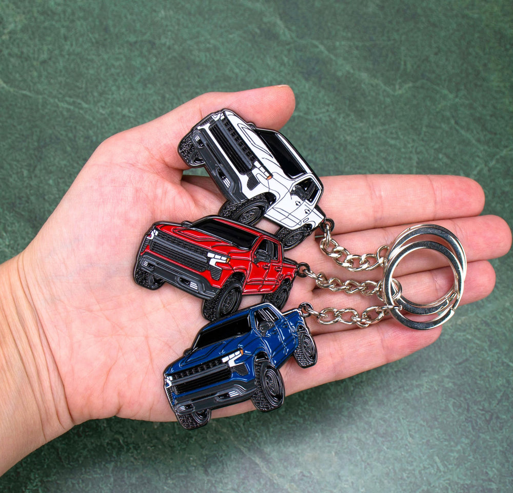 Four Wheel Beast white back view, sturdy keyring attachment shown.