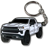 Four Wheel Beast metal keychain white front view, durable enamel detail for Chevy Silverado.