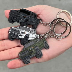 FOUR WHEEL BEAST Tacoma keychain in White adds subtle style to your truck setup.