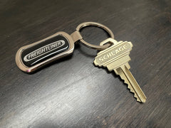Freightliner chrome keychain in gift box, ready for gifting.