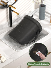 Garoopion adjustable strap and under-seat hook stabilize the bin during driving.