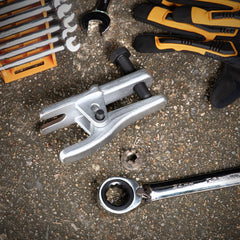 GearWrench ball joint separator in action at the spindle to ease removal.