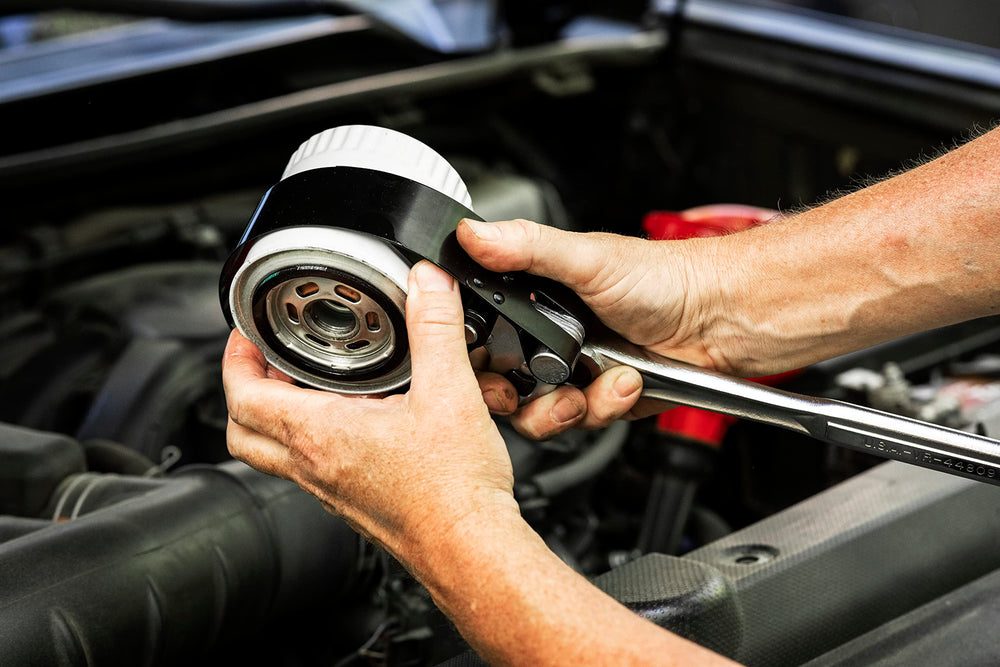 GEARWRENCH oil filter wrench used in a tight engine bay