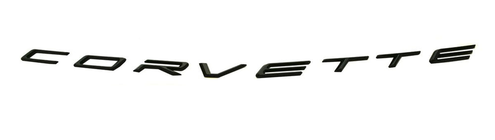 C8 Corvette rear badge close-up in glossy black for a premium look.