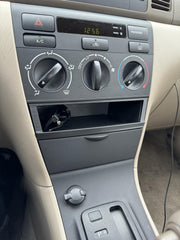 Generic center console bezel for Corolla 03-08 installs quickly with preinstalled tape