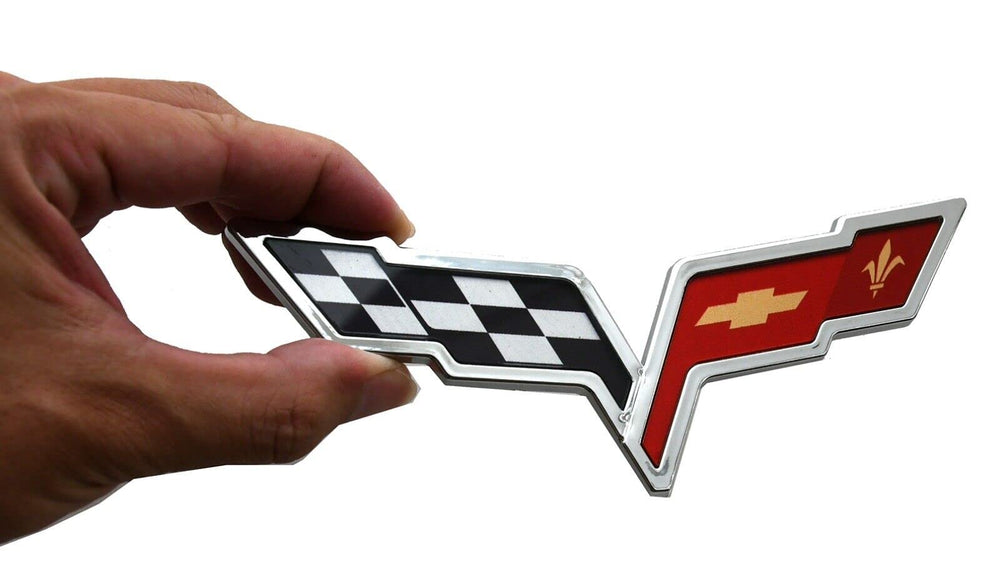 Generic Corvette emblem rear-crossed flags close-up with durable chrome red finish.
