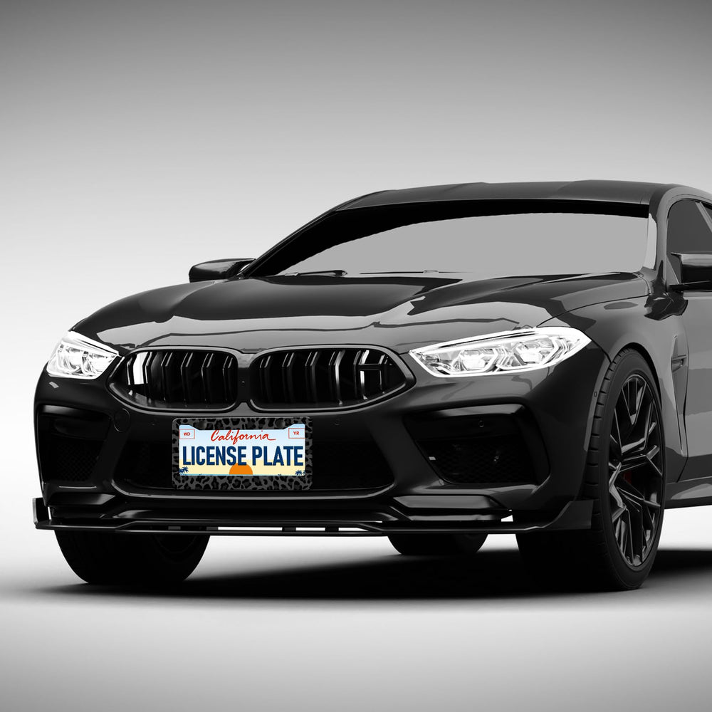 Durable aluminum leopard license plate frame designed for all-weather use.