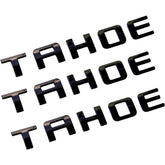 Generic Tahoe emblems front view with glossy black finish for bold styling.