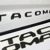 Generic tailgate insert letters for Tacoma in matte black add a bold 3D appearance.