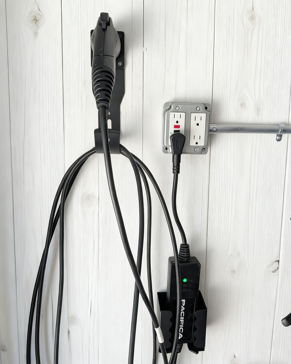 Generic wall mount supports broad compatibility with various portable EV chargers.