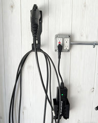 Generic wall mount supports broad compatibility with various portable EV chargers.