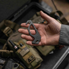 One-handed deployment of Gerber seatbelt cutter in tight spaces