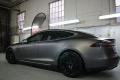 Heinaroman charcoal-grey wrap outdoors resisting weather to protect paint and extend surface life.