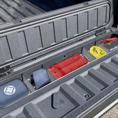 HGWEI tailgate dividers inside slots; secure compartments for roadside kit.
