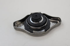 Close-up of Honda radiator cap top showing precision fit for reliable performance.
